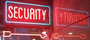 red glowing sign that says security for Cyber Security Month