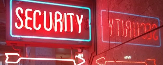 red glowing sign that says security for Cyber Security Month